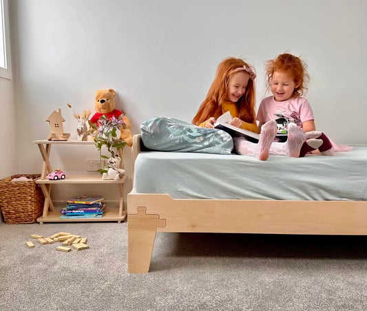 Two kids reading in a cosy bedroom with Montessori and bunk beds — KitSmart NZ-made children’s furniture