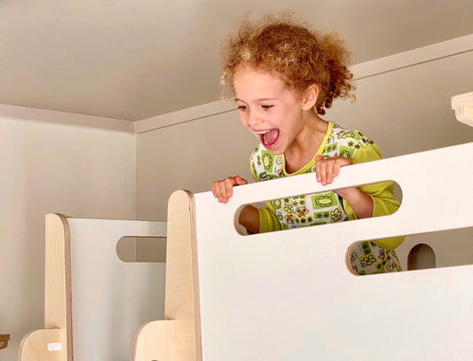 A bright kids’ room with a bunk bed and study desk made from natural wood — KitSmart children’s furniture Australia