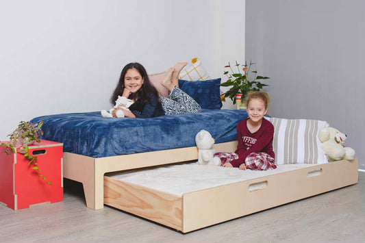 Birch plywood trundle bed for kids — smooth-rolling extra bed that saves space in modern family rooms