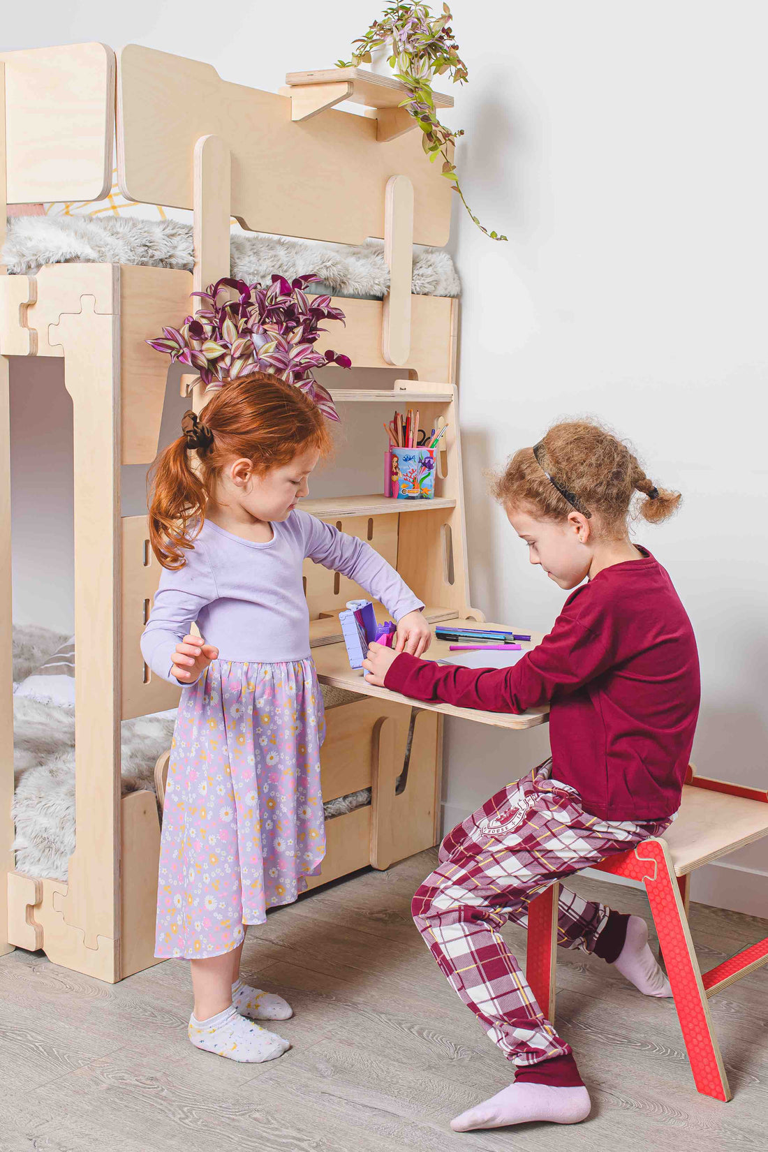 Space-saving kids bunk bed with built in pegboard with desk and shelves NZ