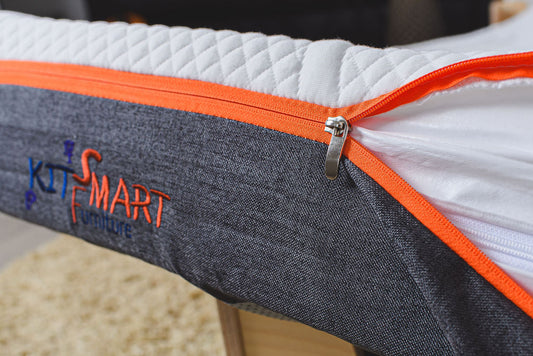 Flippable kids’ mattress with removable washable cover and waterproof inner layer for easy care