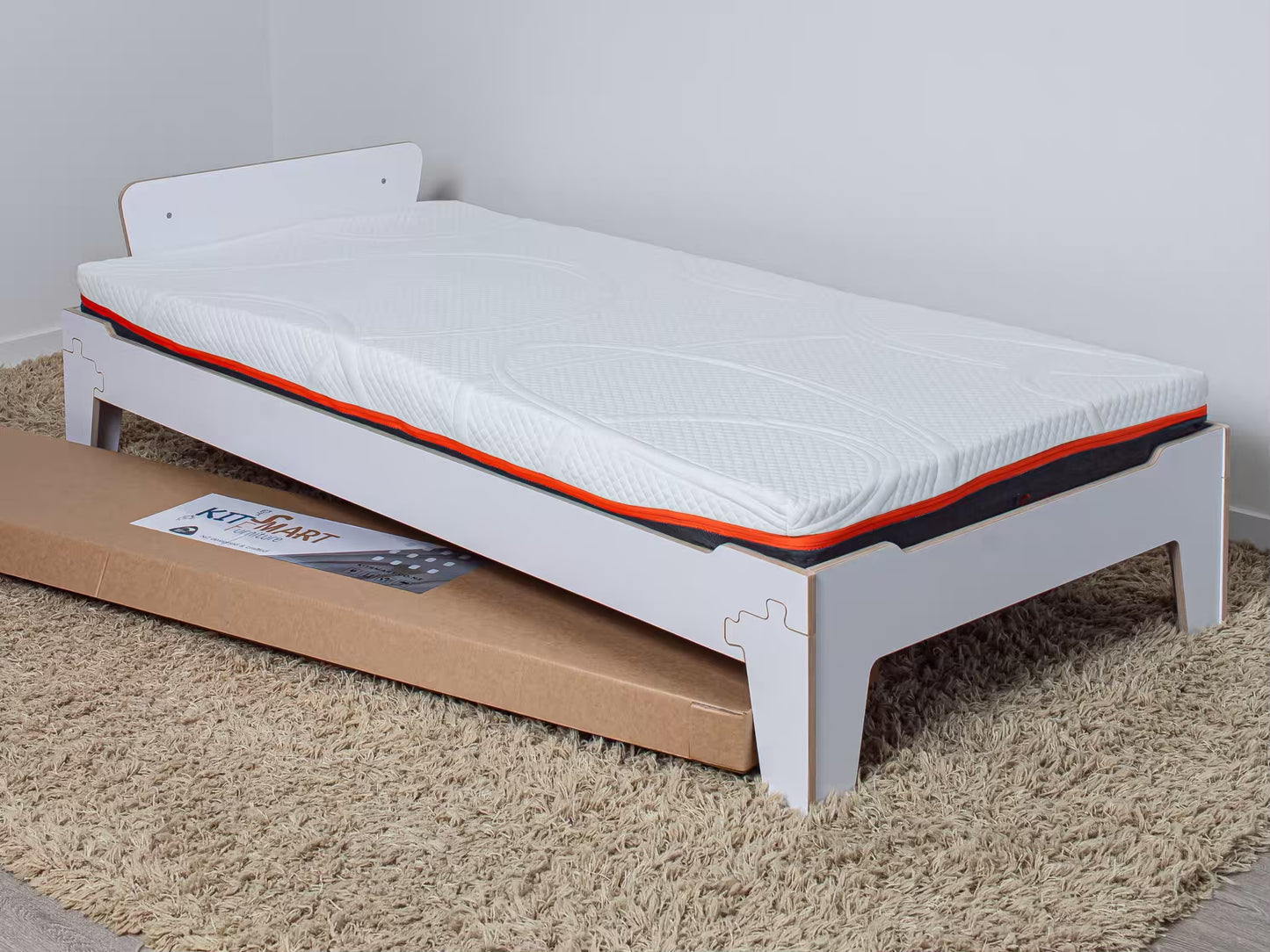 Easy-clean flippable kids’ mattress with waterproof layer on a safe wooden bed for everyday comfort
